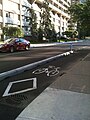 Cycle tracks with concrete barriers in downtown Ottawa, Ontario, Canada on Laurier Avenue in 2011.