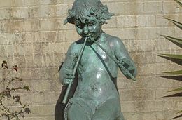 Brookgreen Gardens - sculpture garden: Seated Faun by Janet Scudder, 1924. Signed on left of base