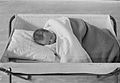 An infant sleeping in 1940. The use of pillows and blankets is no longer recommended as these can inadvertently cause suffocation.