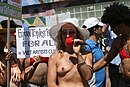 A demonstrator protesting for equal rights for women, wearing a pastie in the form of a nipple (2011)