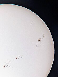 Sunspots viewed through a telescope with a Herschel Wedge.