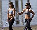 Two girls exercising in jog bras on Cayucos Beach