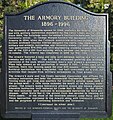 Frontside of a plaque outside the Armory