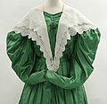 White cotton double pelerine, green silk dress