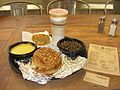 The pulled pork sandwich with cheese grits and wild rice, purchased on opening day