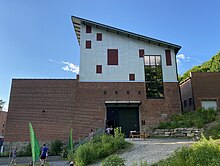 The exterior of AMP's renovated brick mill building.