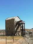 This unique pump engine, typical of that invented by Thomas Newcomen of Cornwall in 1712, was used to pump water from the O'Okiep mine during the period 1882 to 1929. The pump engine was restored in 1965-1968. This unique pump engine, typical of that invented by Thomas Newcome of Cornwall in 1712, was used to pump water from the O'Okiep mine during the period 1882 to 1929. The pump engine was restored in 1965-1968.