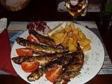 Grilled sardines with tomato and potato, Portugal