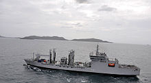 A ship entering a naval harbor