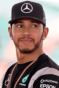 photo of Lewis Hamilton wearing a black Mercedes cap and shirt