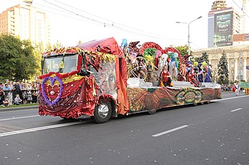 A flatbed truck being used as a parade float