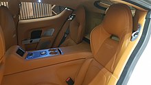 The orange coloured rear seating of the Aston Martin Rapide S