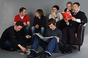 Members of Belle and Sebastian, pictured sometime between 2001 and 2006. Left to right: Mick Cooke, Richard Colburn, Bobby Kildea, Chris Geddes, Stevie Jackson, Sarah Martin, Stuart Murdoch)