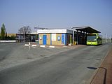 Entrance with a shuttle bus to the airport waiting outside (prior to opening of Line 14 extension)