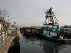 Hiram M. Chittenden Locks: tug and barge in lock when full.