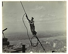 A photograph of a cable worker, taken by Lewis Hine as part of his project to document the Empire State Building's construction