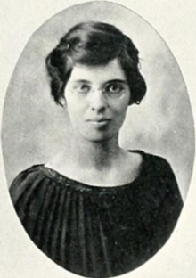 Yearbook photo of a young white woman with dark hair and glasses