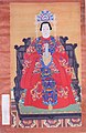 Ming dynasty noblewomen wearing a blue embroidered xiapei over her red robe.