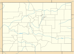 A map of Colorado showing county boundaries and major rivers. There is a red dot in the western corner of Pitkin County, in the western central region of the state