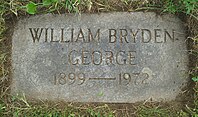 Flat grey granite marker engraved with George's name, birth year and death year