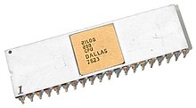A close-up of a silver computer chip with a gold square on a white background. The chip has text on it that says "ZILOG Z80 CPU DALLAS 7623".