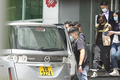 Apple Daily vice-president Chan Pui-man were taken away by police