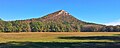 Mountain rises from a flat floodplain