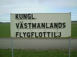 Flottiljens namn, vilket tidigare satt på vaktkasernen.