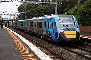 A high capacity metro train at a station in Melbourne