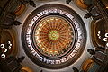 Image 21The dome of the Illinois State Capitol. Designed by architects Cochrane and Garnsey, the dome's interior features a plaster frieze painted to resemble bronze and illustrating scenes from Illinois history. Stained glass windows, including a stained glass replica of the State Seal, appear in the oculus. Ground was first broken for the new capitol on March 11, 1869, and it was completed twenty years later. Photo credit: Daniel Schwen (from Portal:Illinois/Selected picture)