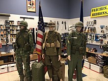 Mannequins dressed in military surplus from WW2 to Vietnam.