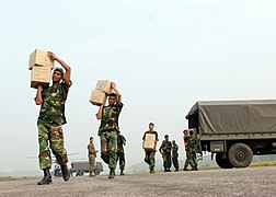Bangladesh Army personnel unloading boxes of food for cyclone victims at Barisal