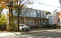 220-22 Division St. (about 1875), frame row houses and small church.