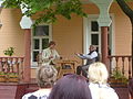 Actors perform a story from Chekhov on the veranda of his house at Melikhovo, June 2011