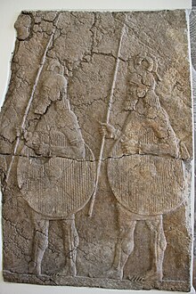 Relief depicting two Assyrian soldiers