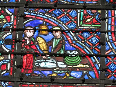 Window of Saint-Julien-L'Hospitalier, depicting fish-merchants, the sponsor of the window (Bay 23)