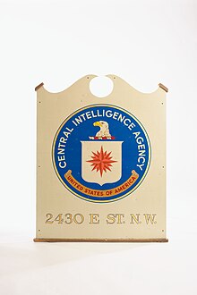 A picture of a sign with the CIA logo, and the words "2430 E. Street Northwest" below it.
