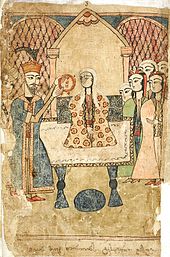 Le roi Rostévan, à gauche, tend la couronne pour la placer sur la tête de Tinatine, assise au centre sur un grand trône, entourée de quelques femmes.