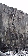 Lead climbing pair on a single pitch climb