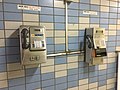 Payphones mounted on a subway wall, South Korea.