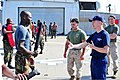 U.S. Coast Guard Auxiliary member translating for U.S. Marine Corps.