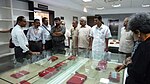 Curator Carlos Fernandes (left) shows valuable collections to visitors during PubNext2012.