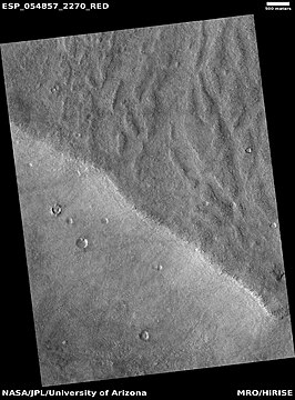 Channels that may have been made by the backwash of tsunamis in an ocean. Image is from HiRISE under the HiWish program.