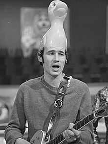 Innes performing with the Bonzo Dog Band with a duck hat