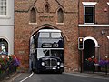Image 24The sharply-arched Beverley Bar necessitated a special bus design. A preserved East Yorkshire Motor Services AEC Bridgemaster with an arched roof passes under the Bar in August 2022. (from Lowbridge double-deck bus)