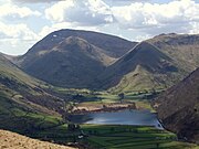 Red Screes and Middle Dodd seen beyond Brothers Water from the Patterdale Valley. On the right is High Hartsop Dodd.