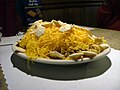 A "4-way Cincinnati chili" is spaghetti topped with a Greek-inspired meat sauce, chopped onions, and shredded cheddar.