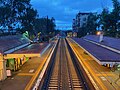 Fairfield railway station as viewed from the pedestrian overpass at dusk