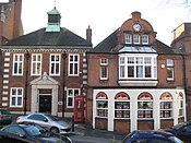 The former fire station (right) now an estate agent, and on the left the former headquarters of Harrow Urban District (now the London Borough of Harrow)