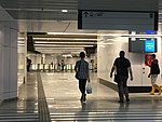 Commuters walking towards the MRT station from the link